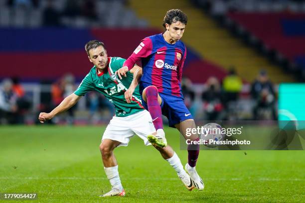 Antoni Gorosabel of Deportivo Alaves and Joao Felix of FC Barcelona during the La Liga EA Sports match between FC Barcelona and Deportivo Alaves...