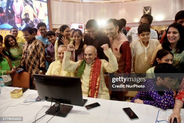 Stock broker and his family reacts as they watch a terminal during a special ''muhurat'' trading session for Diwali, the Hindu festival of lights, at...