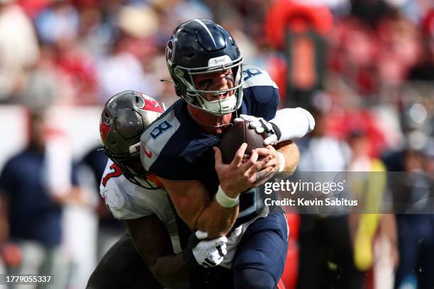 Shaquil Barrett of the Tampa Bay Buccaneers sacks Will Levis of the Tennessee Titans during the first quarter of an NFL football game at Raymond...