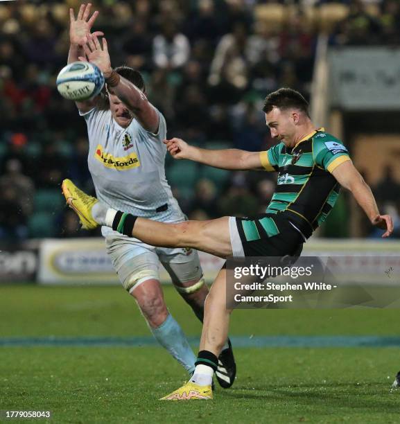 Northampton Saints' Tom James kicks as Exeter Chiefs' Jacques Vermeulen attempts to block during the Gallagher Premiership Rugby match between...