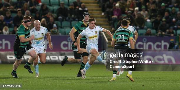 Exeter Chiefs' Will Haydon-Wood kicks past Northampton Saints' Tom James during the Gallagher Premiership Rugby match between Northampton Saints and...