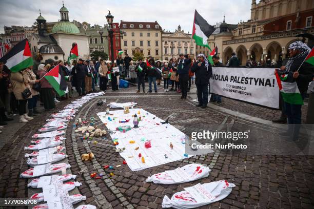 Bundles symbolizing dead children are seen during solidarity with Palestine demonstration at the Main Square in Krakow, Poland on November 12, 2023....