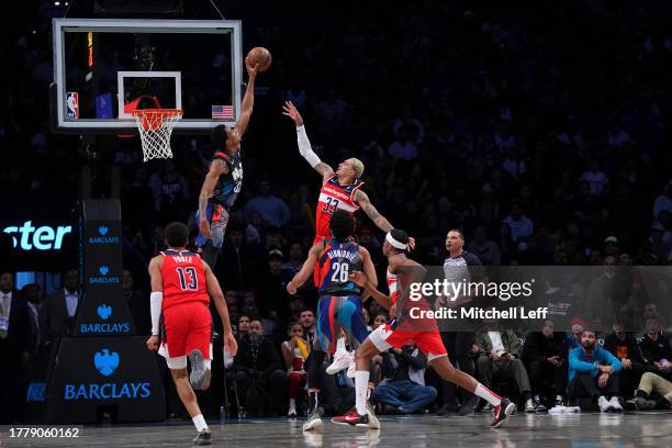Nic Claxton of the Brooklyn Nets blocks the shot of Kyle Kuzma of the Washington Wizards in the second half at Barclays Center on November 12, 2023...