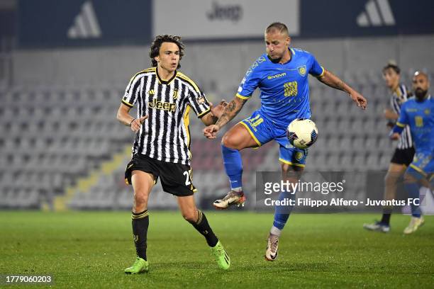 Giuseppe Panico of Carrarese controls the ball while Martin Palumbo of Juventus pressures for the ball during the Serie C match between Juventus Next...