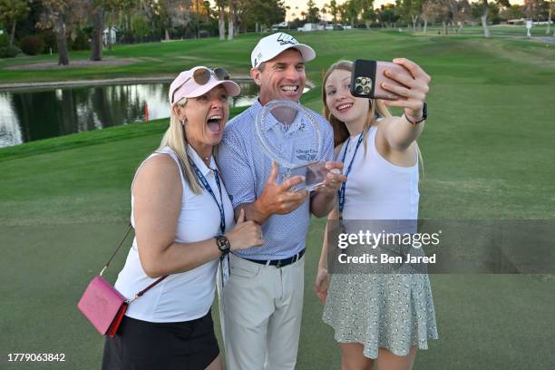 Steven Alker of New Zealand takes a selfie video with his family and the trophy on the 18th green after the final round at the Charles Schwab Cup...