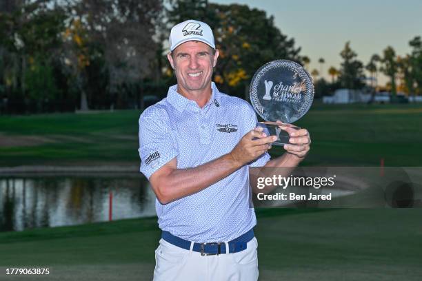 Steven Alker of New Zealand holds the trophy on the 18th green after the final round at the Charles Schwab Cup Championship at Phoenix Country Club...