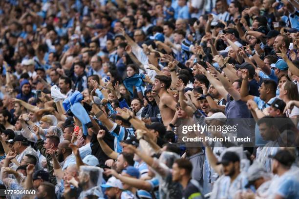 Fans of Gremio cheer for their team during the match between Gremio and Corinthians as part of Brasileirao 2023 at Arena do Gremio Stadium on...