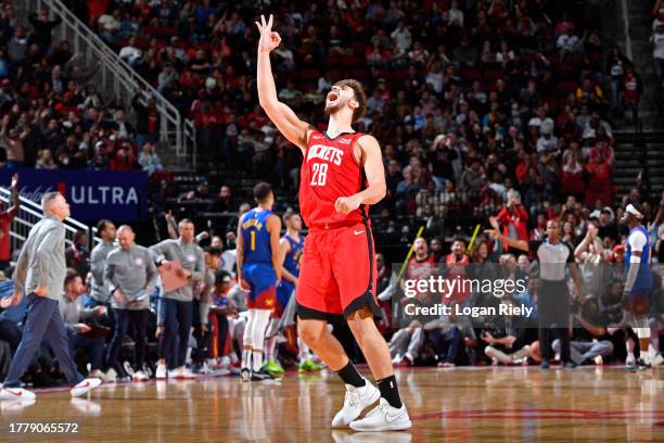 Alperen Sengun of the Houston Rockets celebrates after three point basket during the game against the Denver Nuggets on November 12, 2023 at the...