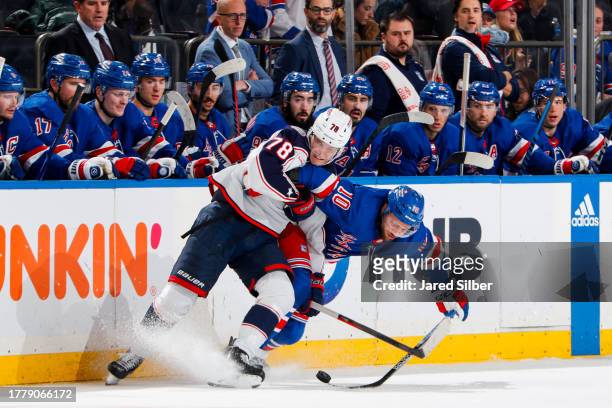 Artemi Panarin of the New York Rangers skates with the puck against Damon Severson of the Columbus Blue Jackets at Madison Square Garden on November...