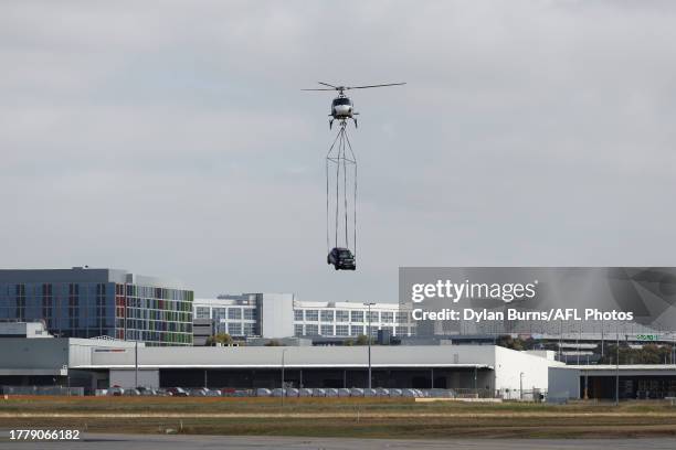 Helicopter is seen carrying a car during a Essendon Bombers Media Opportunity at the Melbourne Jet Base on November 13, 2023 in Melbourne, Australia.