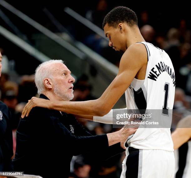 Head coach Gregg Popovich checks on Victor Wembanyama of the San Antonio Spurs at Frost Bank Center on November 12, 2023 in San Antonio, Texas. NOTE...