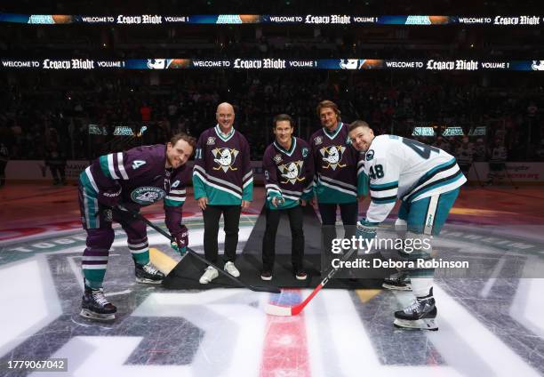 Former Anaheim Ducks players Guy Hebert, Paul Kariya and Teemu Selanne pose with Cam Fowler of the Anaheim Ducks and Tomas Hertl of the San Jose...