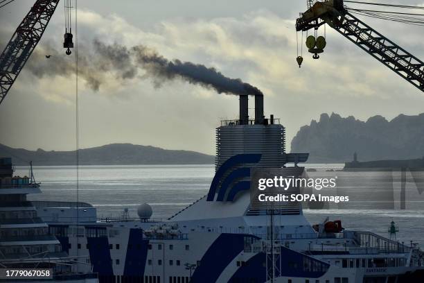 View of the Fantastic spewing out a cloud of black smoke in Marseille. The cruise-ferry Fantastic, docked in the French Mediterranean port of...