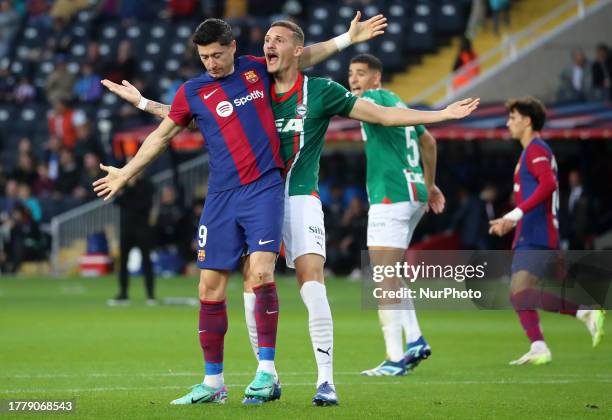 Robert Lewandowski and Rafa Marin during the match between FC Barcelona and Deportivo Alaves, corresponding to the week 13 of LaLiga EA Sports,...