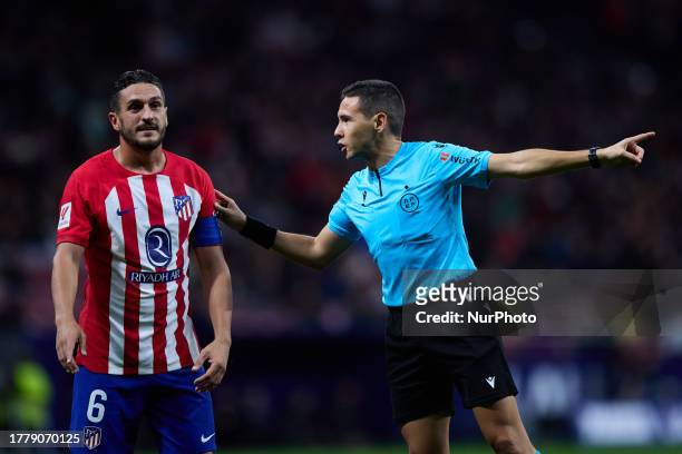 Koke of Atletico de Madrid talks with the referee during the LaLiga EA Sports match between Atletico de Madrid and Villarreal CF at Civitas...