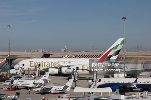 An Airbus A380-800, top left, and Boeing Co. 777-300ER passenger aircraft, operated by Emirates Airlines, at the Dubai Air Show in Dubai, United Arab...
