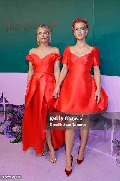 Eliza Spencer and Amelia Spencer pose for a photo during 2023 Melbourne Cup Day at Flemington Racecourse on November 07, 2023 in Melbourne, Australia.