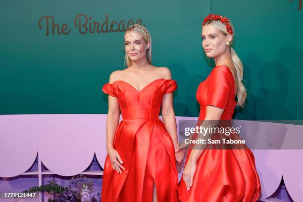 Eliza Spencer and Amelia Spencer pose for a photo during 2023 Melbourne Cup Day at Flemington Racecourse on November 07, 2023 in Melbourne, Australia.