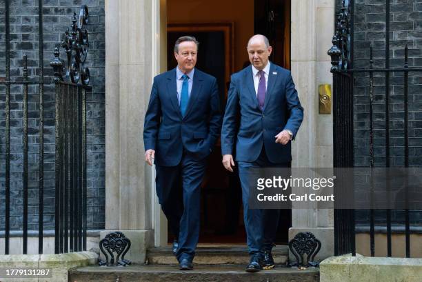 Britain's former Prime Minister, David Cameron , leaves 10, Downing Street with Sir Philip Barton, the Permanent Under-Secretary of the Foreign,...