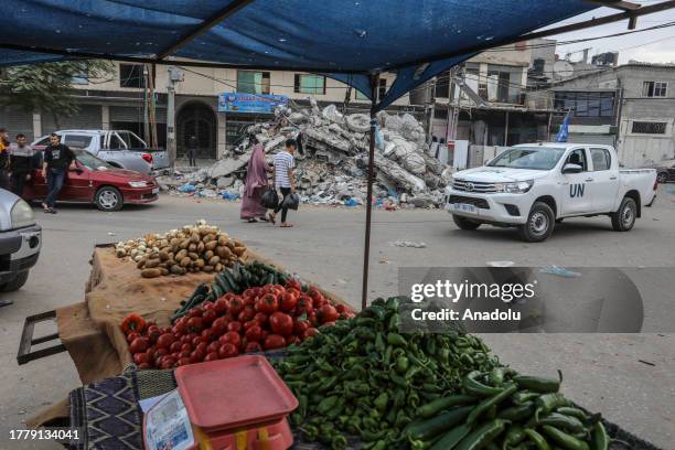Palestinian people go shopping at the bazaar as they try to maintain their daily lives amid the Israeli attacks continue in Rafah, Gaza on November...