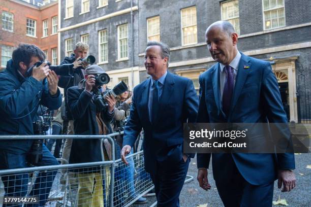 Britain's former Prime Minister, David Cameron, leaves 10, Downing Street with Sir Philip Barton , the Permanent Under-Secretary of the Foreign,...