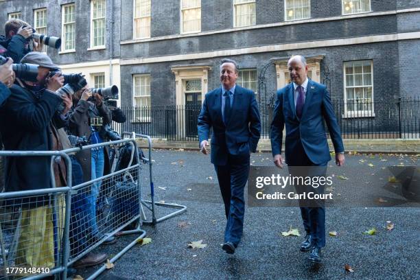 Britain's former Prime Minister, David Cameron , leaves 10, Downing Street with Sir Philip Barton, the Permanent Under-Secretary of the Foreign,...