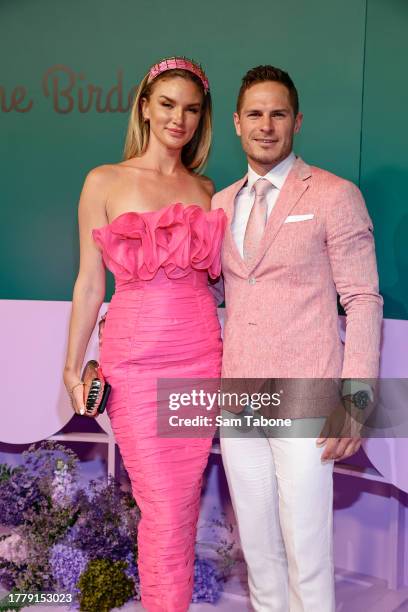 Amy Pejkovic and David Zaharakis pose for a photo during 2023 Melbourne Cup Day at Flemington Racecourse on November 07, 2023 in Melbourne, Australia.