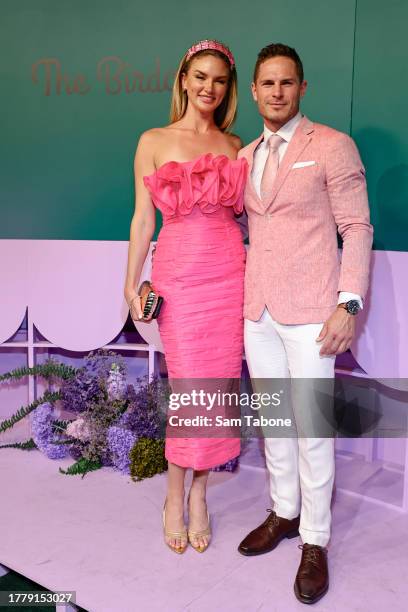 Amy Pejkovic and David Zaharakis pose for a photo during 2023 Melbourne Cup Day at Flemington Racecourse on November 07, 2023 in Melbourne, Australia.