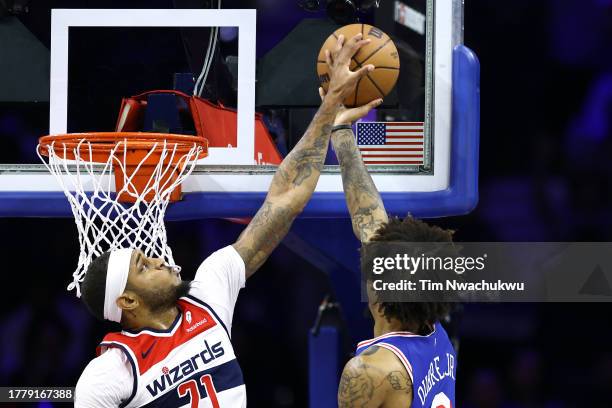 Daniel Gafford of the Washington Wizards blocks Kelly Oubre Jr. #9 of the Philadelphia 76ers during the first quarter at the Wells Fargo Center on...