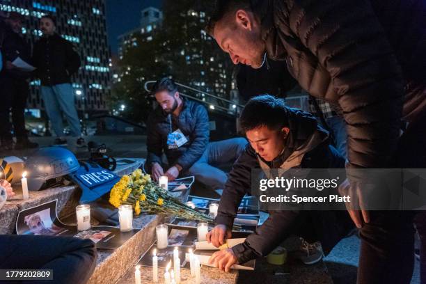 Members of the media and others gather for a vigil in lower Manhattan on November 6, 2023 in New York City. The vigil is held to remember and...