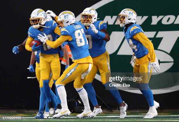 Derius Davis of the Los Angeles Chargers celebrates with teammates after returning a punt for a touchdown during the first quarter against the New...