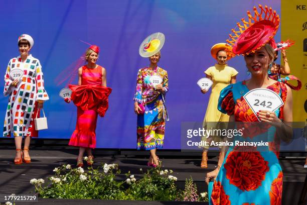Contestants in the fashion on the field competition parade for judges and audience during Melbourne Cup Day at Flemington Racecourse on November 07,...