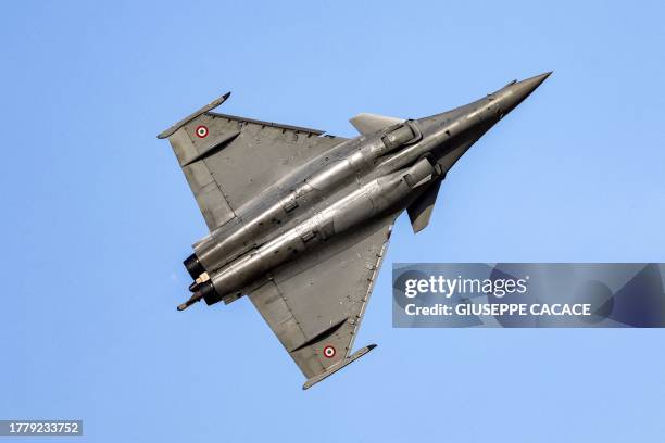 French Air Force Dassault Aviation Rafale canard delta wing multirole fighter aircraft flies over during the 2023 Dubai Airshow at Dubai World...