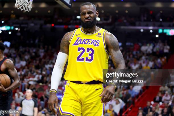 LeBron James of the Los Angeles Lakers reacts after being fouled against the Miami Heat during the first quarter of the game at Kaseya Center on...