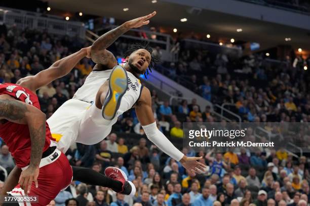 David Joplin of the Marquette Golden Eagles collides with Harvin Ibarguen of the Northern Illinois Huskies in the first half at Fiserv Forum on...