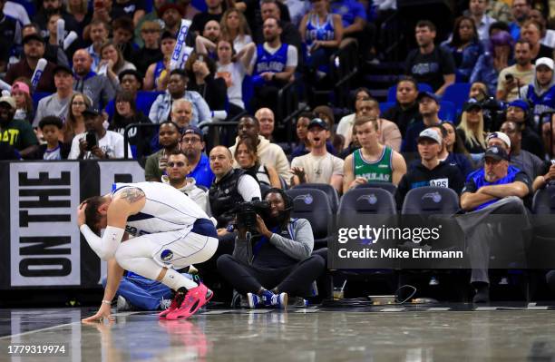 Luka Doncic of the Dallas Mavericks reacts to an injury during a game against the Orlando Magic at Amway Center on November 06, 2023 in Orlando,...