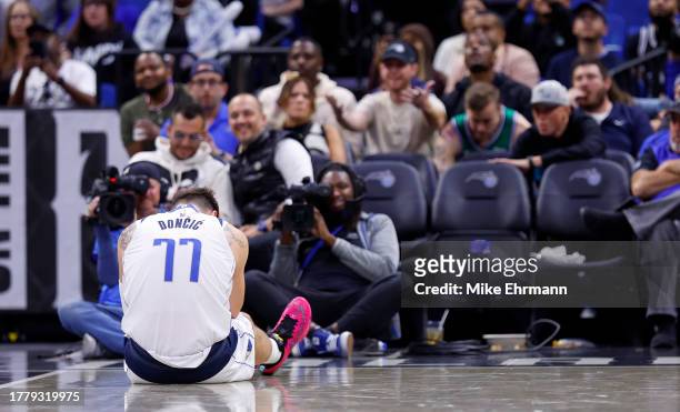Luka Doncic of the Dallas Mavericks reacts to an injury during a game against the Orlando Magic at Amway Center on November 06, 2023 in Orlando,...