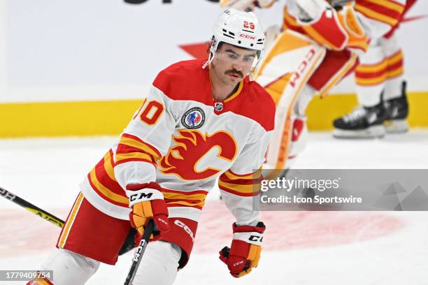 Calgary Flames Center Dillon Dube wearing the Mike Vernon HHOF tribute jersey in warmups prior to the regular season NHL game between the Calgary...