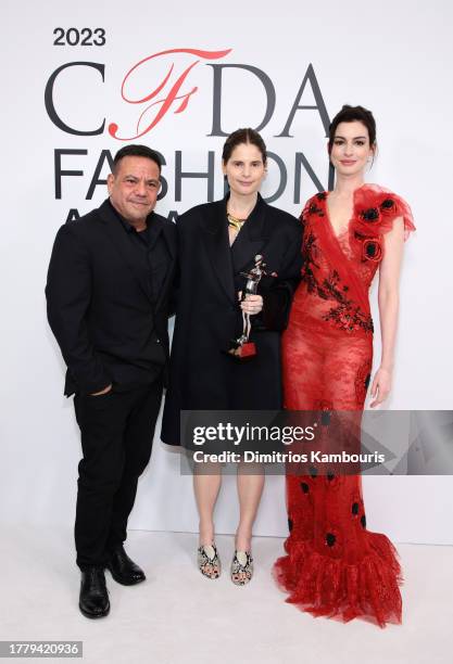 Catherine Holstein, American Womenswear Designer of the Year Award winner , poses with Anne Hathaway and Narciso Rodriguez at the 2023 CFDA Fashion...