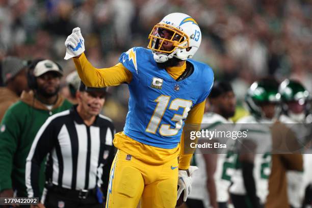 Keenan Allen of the Los Angeles Chargers celebrates after catching a pass with one hand during the fourth quarter against the New York Jets at...