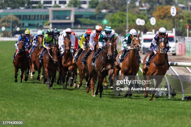 Horses come toward the bend in the Lexus Melbourne Cup at Flemington Racecourse on November 07, 2023 in Melbourne, Australia.