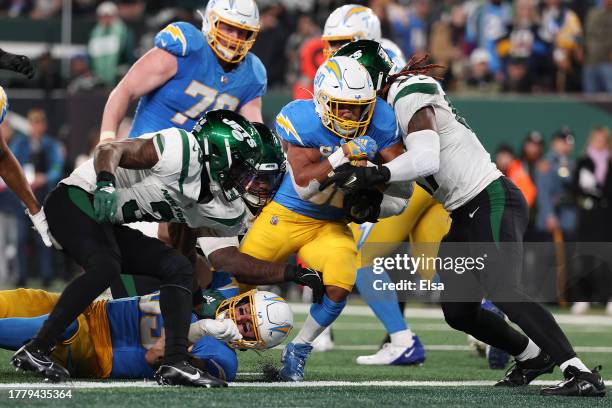 Austin Ekeler of the Los Angeles Chargers scores a touchdown during the fourth quarter against the New York Jets at MetLife Stadium on November 06,...