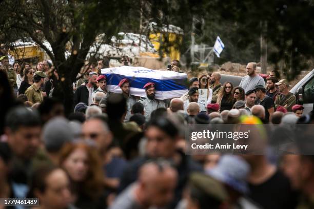 Family and friends mourn during the funeral of fallen soldier Matan Meir, killed in the Gaza Strip on November 13, 2023 in Odem, Israel. More than 40...