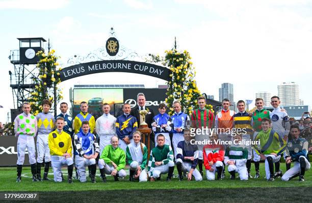 The 2023 jockeys pose for a group photo before riding in Race 7, the Lexus Melbourne Cup, during Melbourne Cup Day at Flemington Racecourse on...