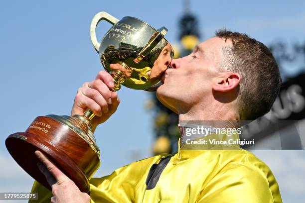 Mark Zahra poses with trophy after riding Without A Fight to win Race 7, the Lexus Melbourne Cup, during Melbourne Cup Day at Flemington Racecourse...