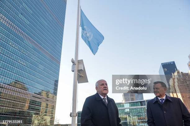 Palestinian Ambassador Riyad Mansour is seen as the United Nations flag is lowered to half-mast in respect for the UN staff killed from Gaza in New...