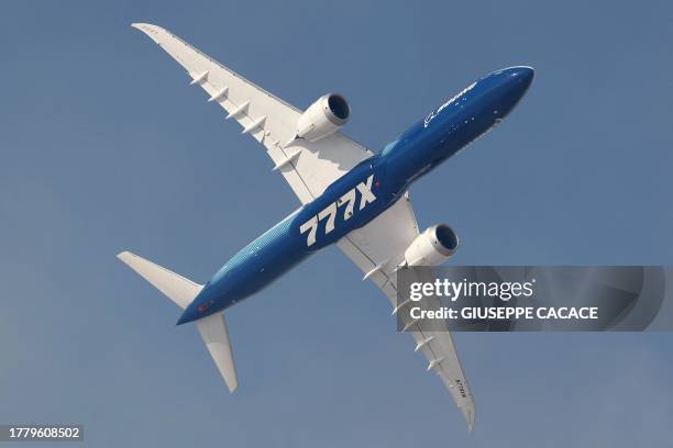 Boeing 777-X aircraft flies during the 2023 Dubai Airshow at Dubai World Central - Al-Maktoum International Airport in Dubai on November 13, 2023.