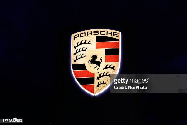 The Porsche logo, the German automobile manufacturer specializing in high-performance luxury sports cars, SUVs, and sedans, headquartered in...