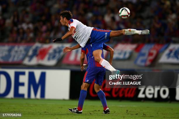 Ryoichi Maeda of FC Tokyo and Michael James Fitzgerald of Albirex Niigata compete for the ball during the J.League J1 second stage match between FC...