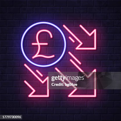 Pound decrease. Glowing neon icon on brick wall background Pound decrease. Glowing neon icon on brick wall background